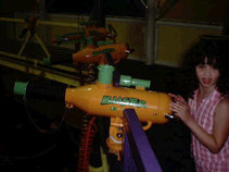 Miranda behind a ball blaster