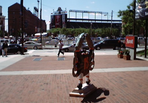 Crab in Orioles uniform with Camden Yards in the background