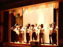 Sally Ride teachers in top hats on stage