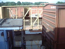 Rail cars with water overwhelming the tracks