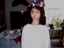 Miranda with a red, white and blue garland on her head.