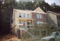 Subcontractors putting on siding